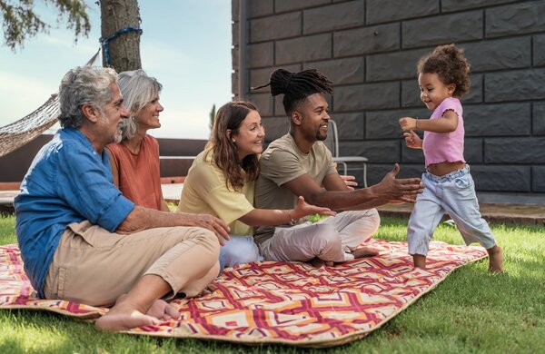 toddler_playing_with_parents_and_grandparents_at_t_2023_12_13_07_05_45_utc